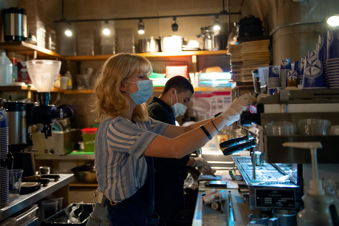 Barista working at a cafe in NYC