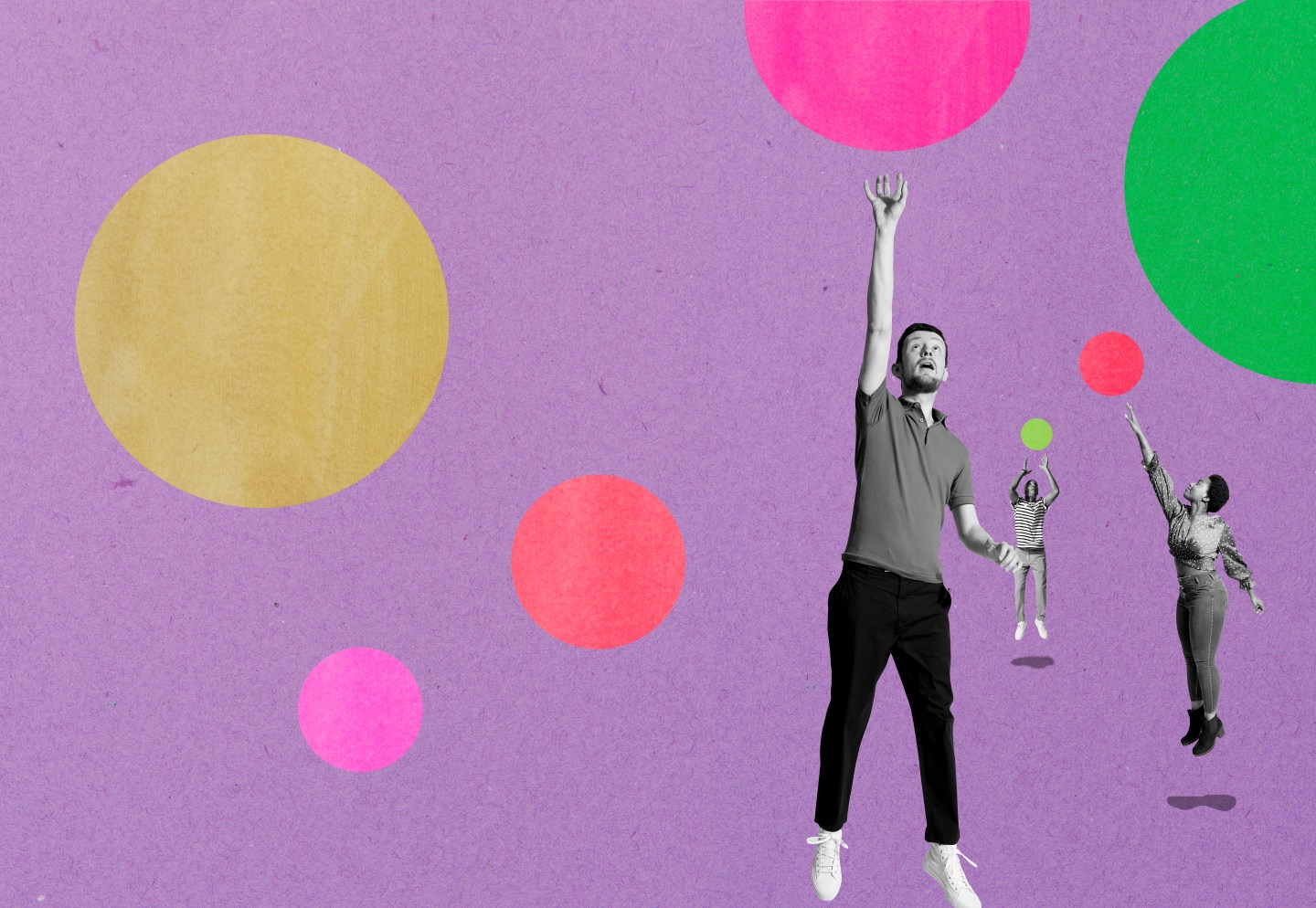 Three people leaping up to catch bubbles.