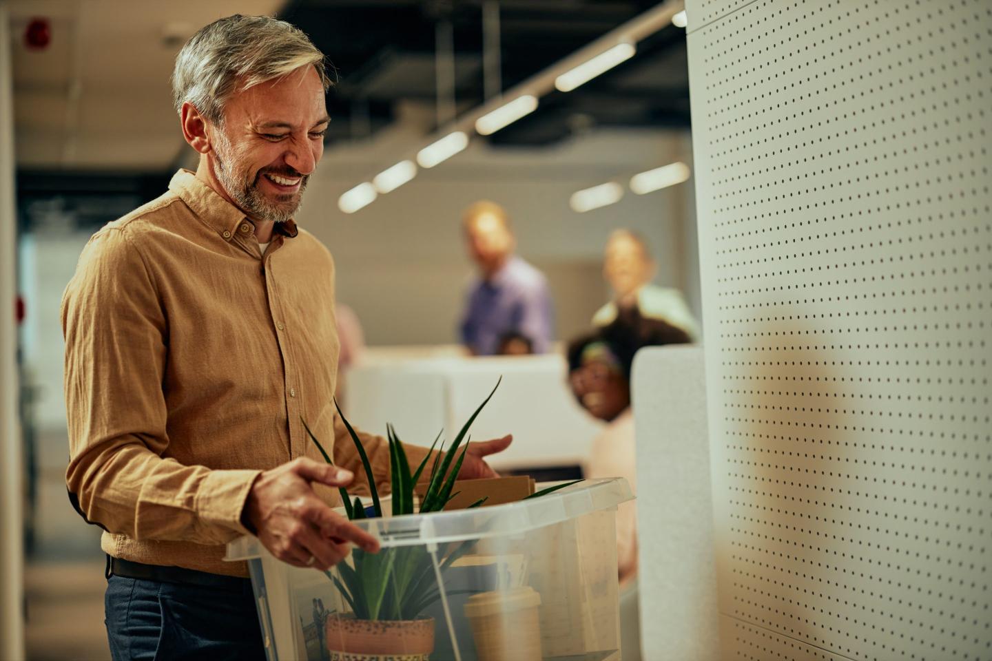 77% of workers say they’re returning to the office in January— and more than half are looking forward to it