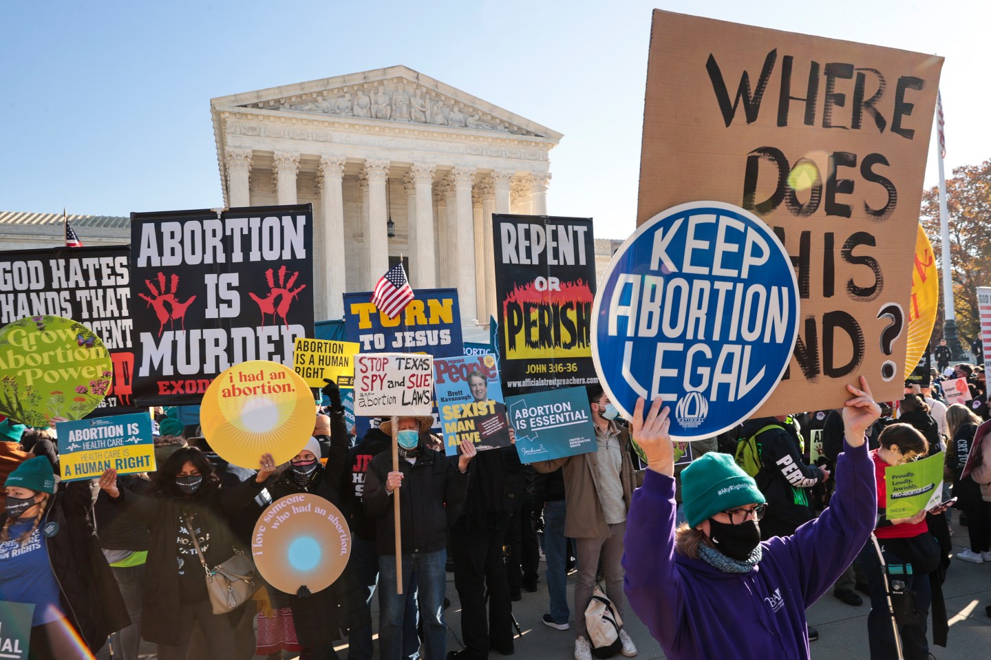 Protestors outside of the supreme court as justices hear abortion case.