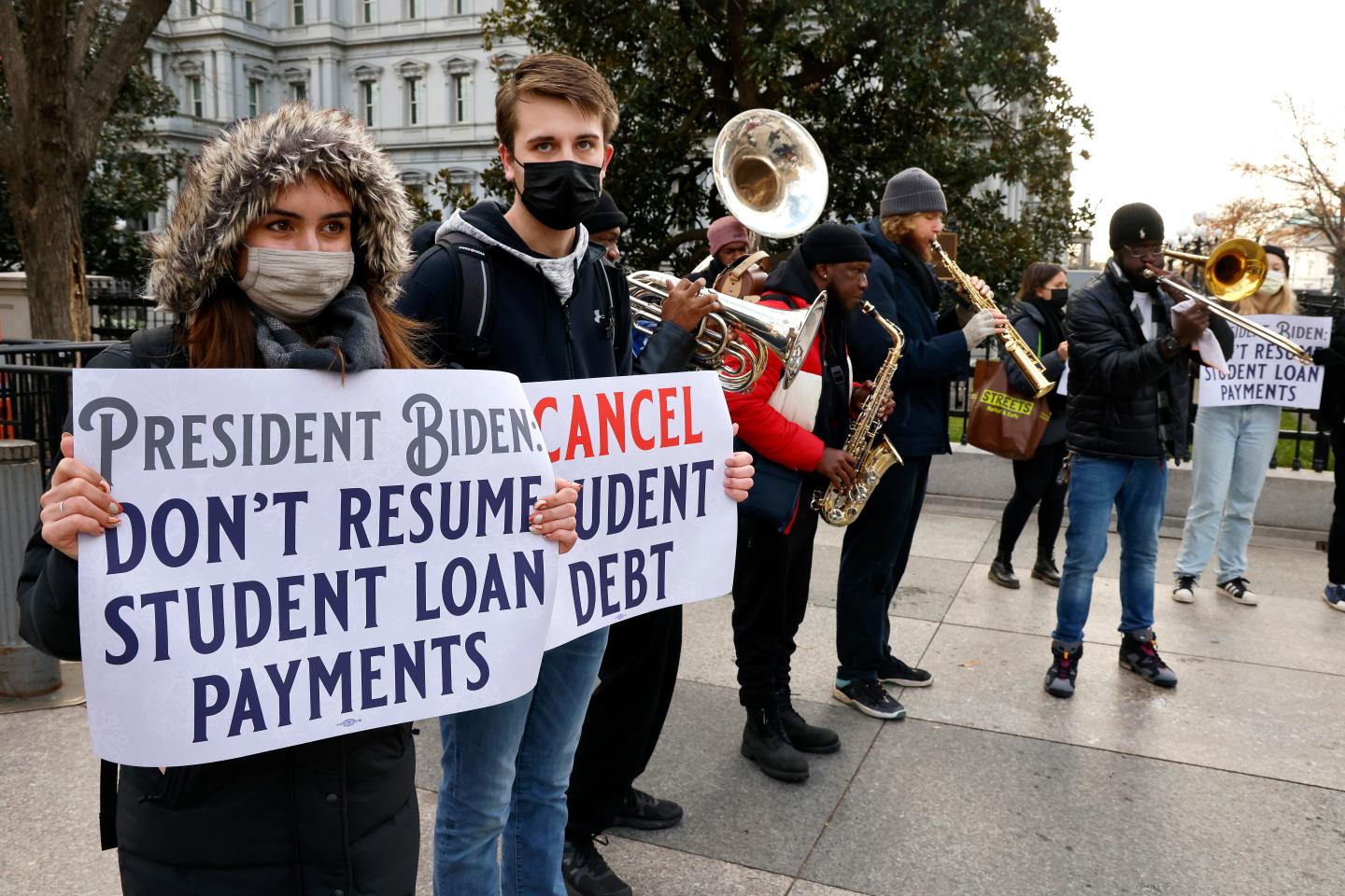 Biden extends freeze on student loan payments through May 1