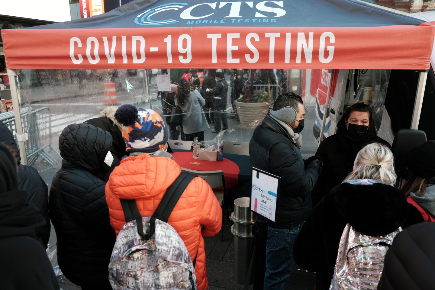 People outside of a COVID testing tent in New York City.