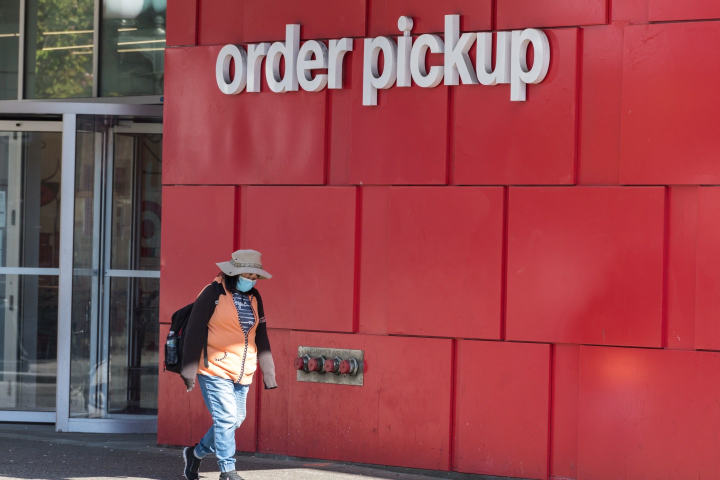 A person walks past a Target store in Seattle.