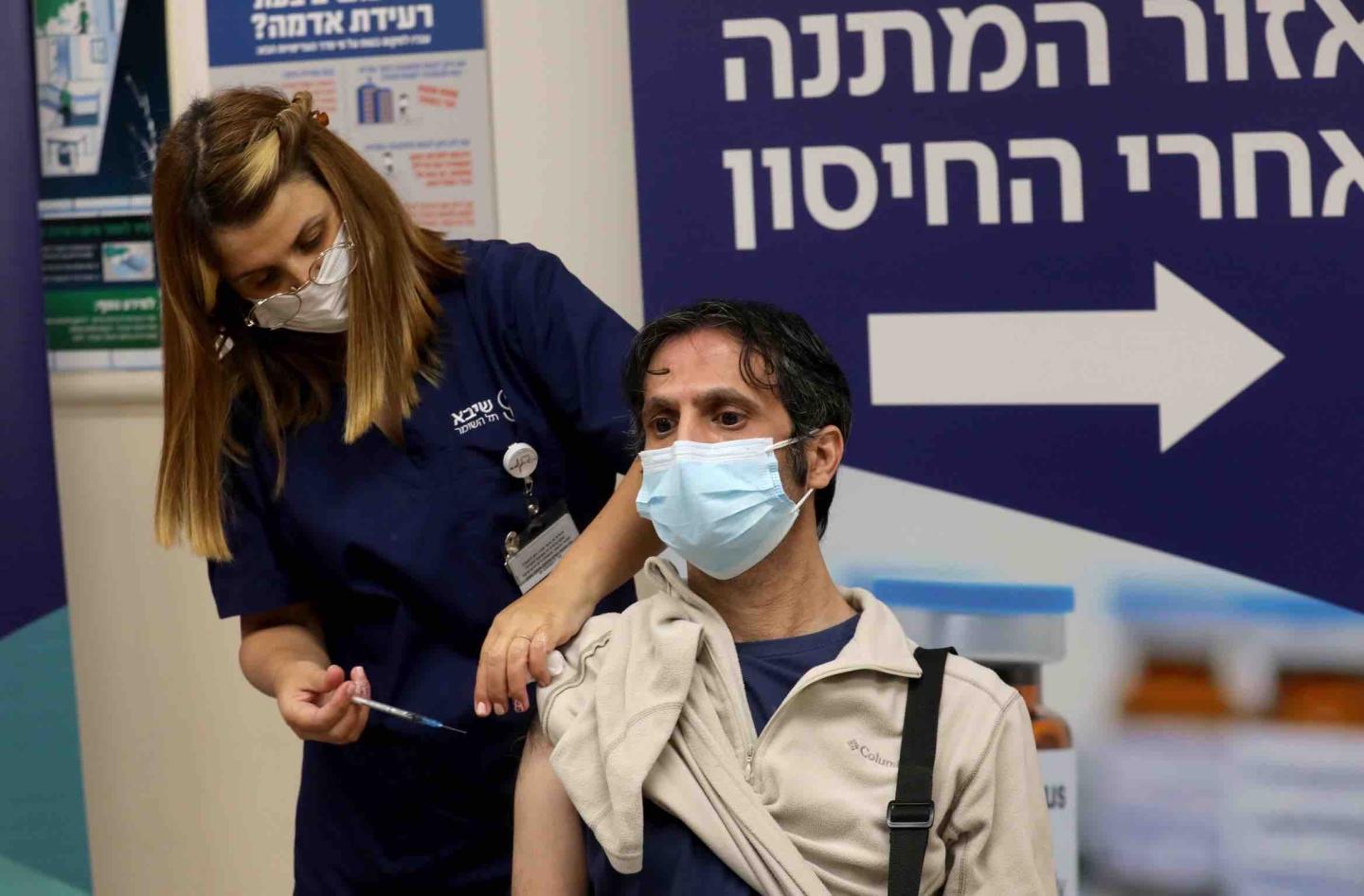 A man receives a fourth dose of COVID-19 vaccine at Sheba Medical Center in central Israeli city of Ramat Gan on Dec. 31, 2021.