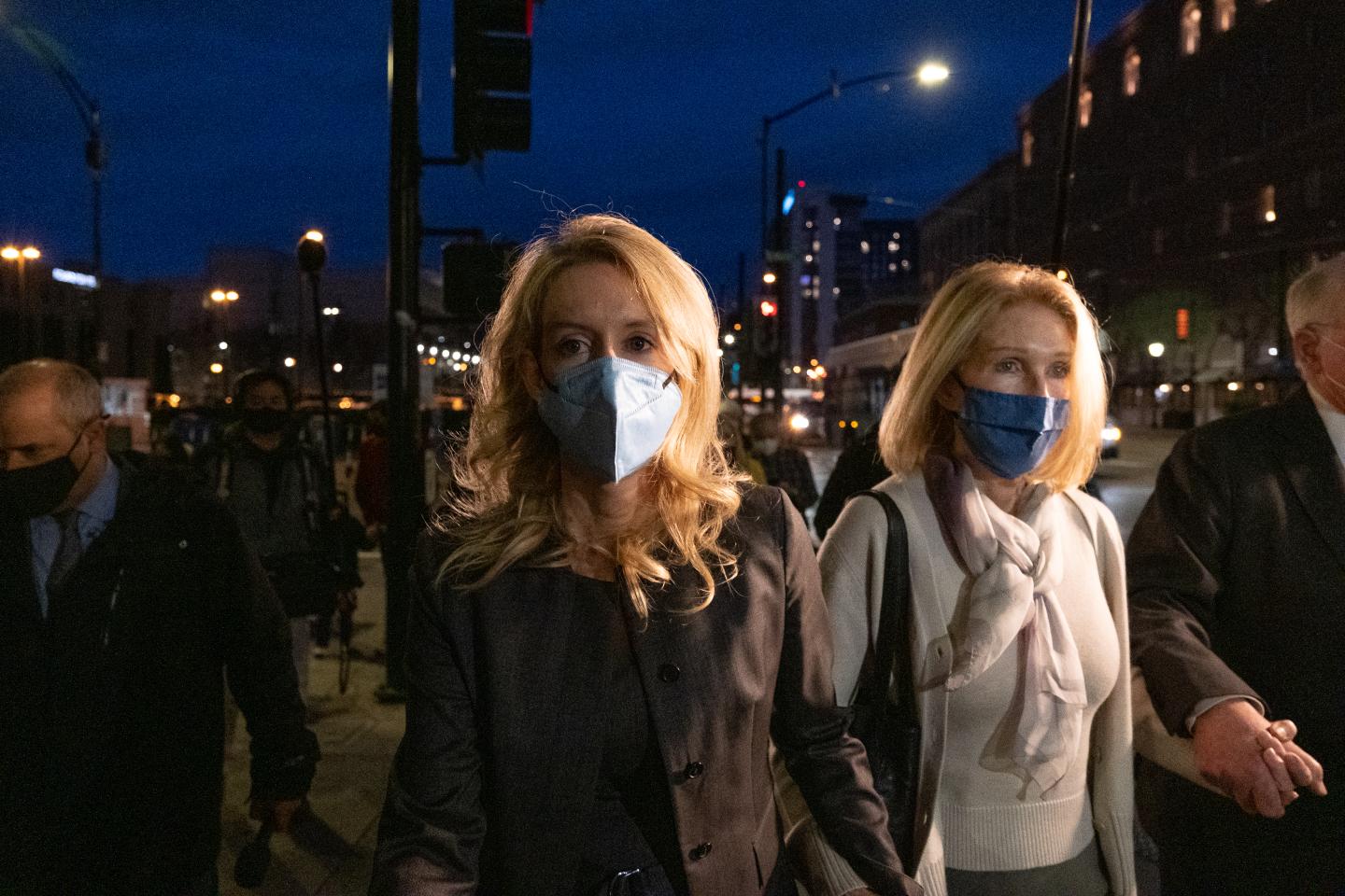 Theranos founder and former CEO Elizabeth Holmes (C) and her mother Noel Holmes leave the Robert F. Peckham Federal Building on January 3, 2022 in San Jose, California.