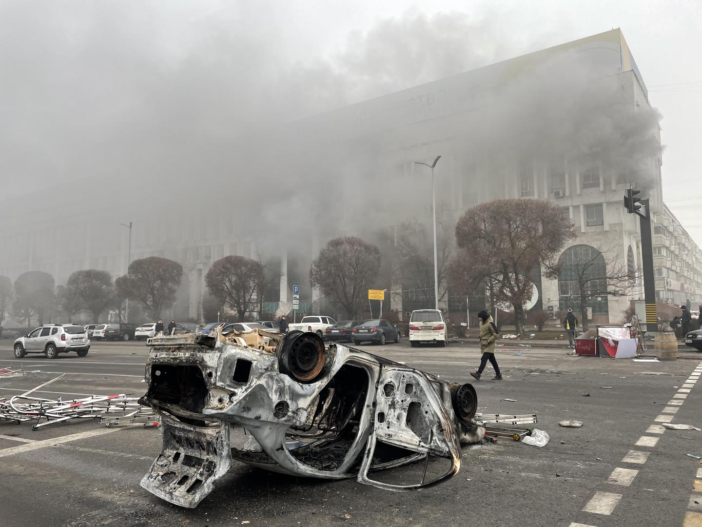 ALMATY, KAZAKHSTAN - JANUARY 6, 2022: A burnt out vehicle which was set on fire during unrest is seen in Republic Square.