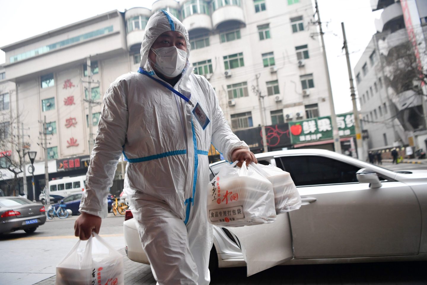 A volunteer delivers food during a COVID lockdown in China.