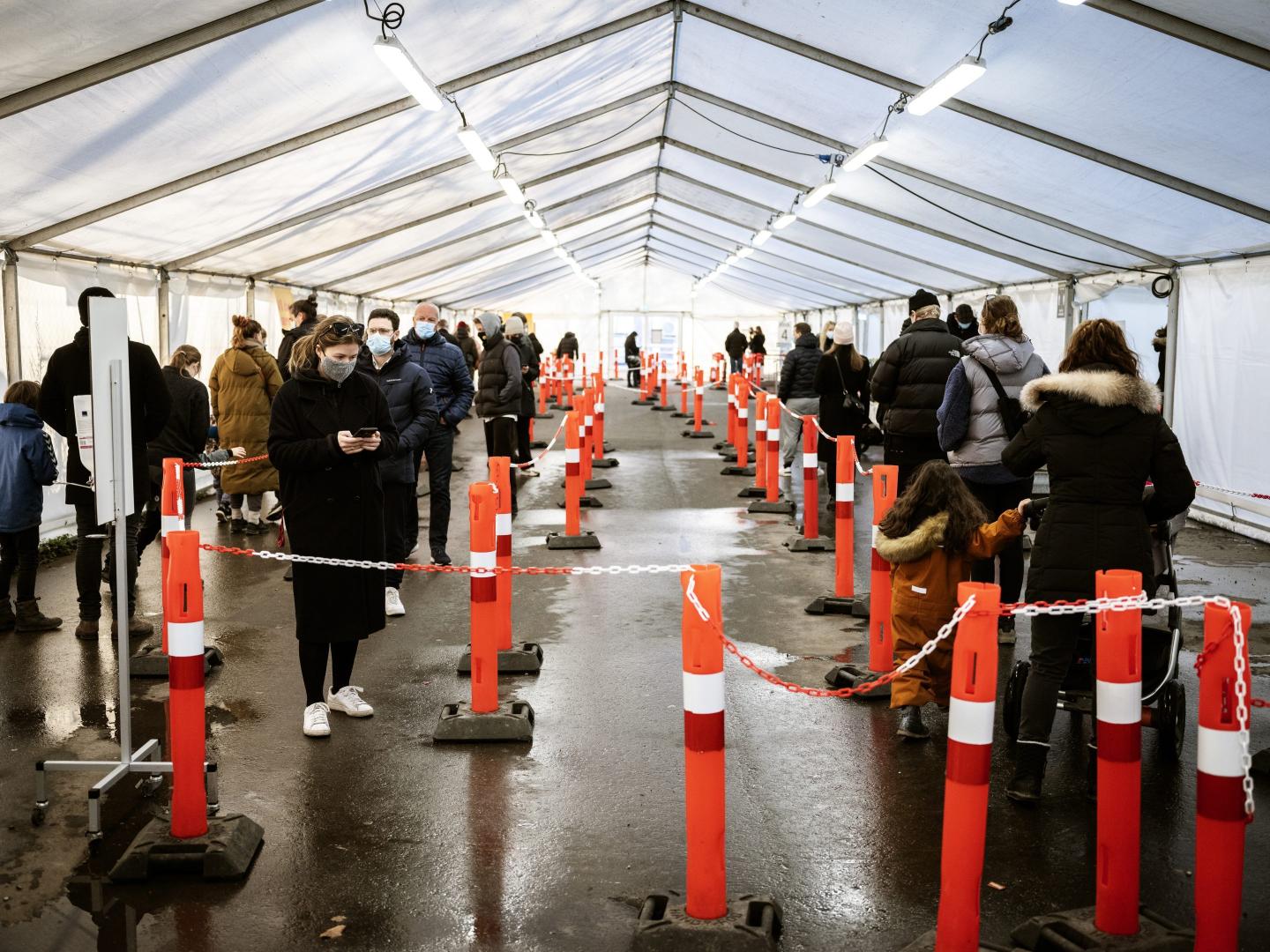 People wait in line for a COVID-19 test outside Copenhagen.