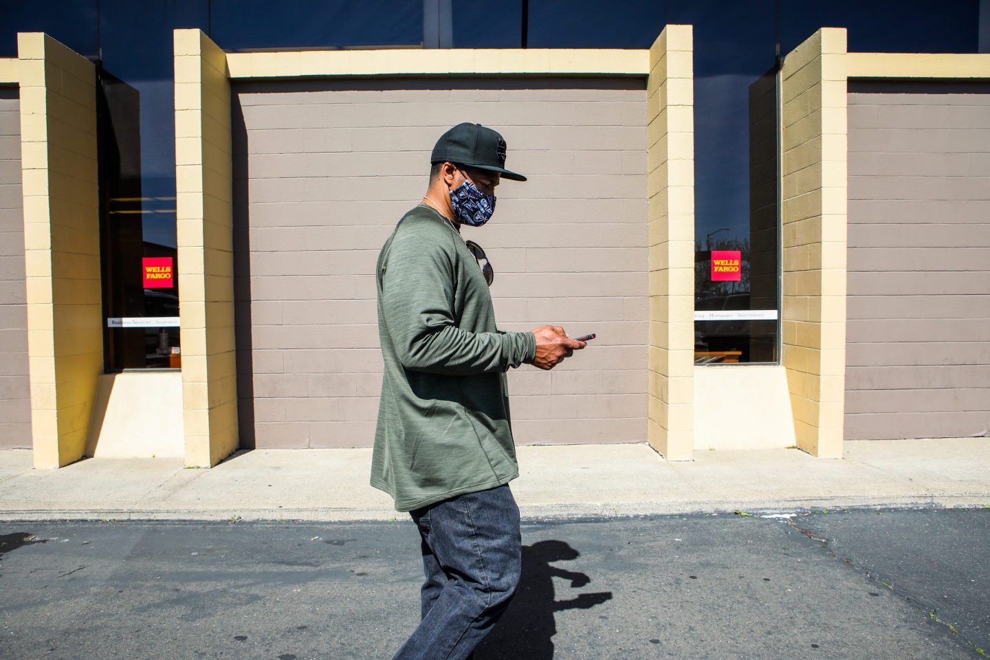 Jeremy Puckett, 44, leaves a Wells Fargo branch in Sacramento, Calif., in 2021. Puckett spent nearly two decades behind bars for a murder he didn't commit. His exoneration coincided with the beginning of the pandemic.