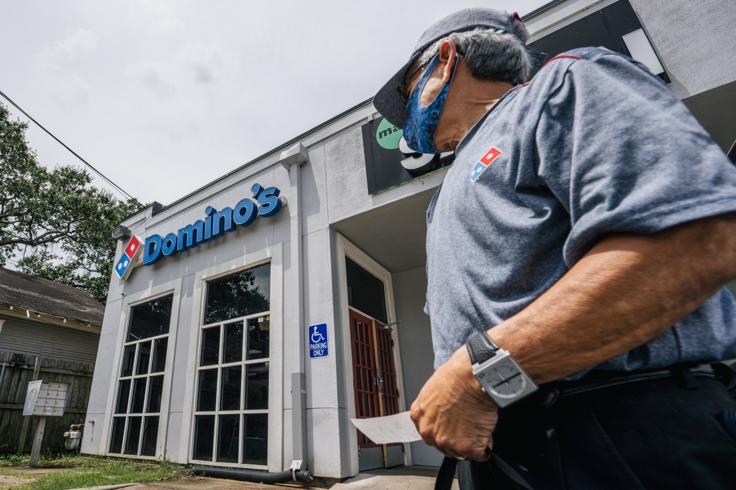 A Domino's Pizza employee.