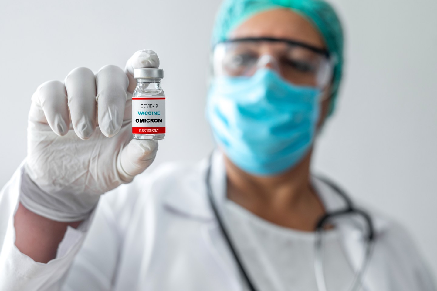 Health care worker holding a vial of coronavirus vaccine.