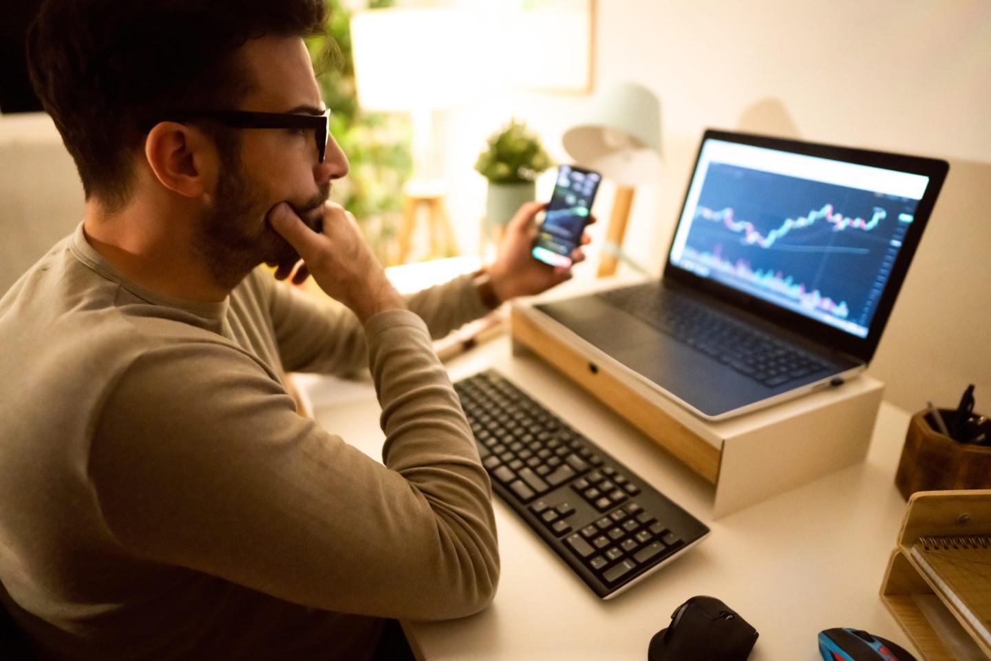 Man looking at his investments online