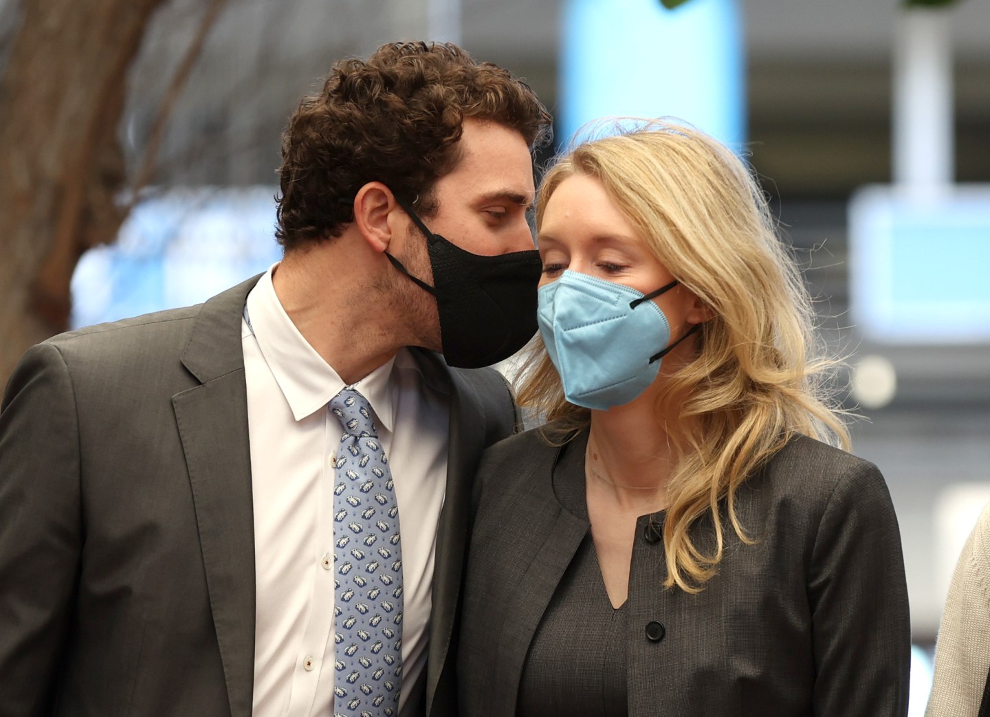 Billy Evans (L) walks with his partner Theranos founder and former CEO Elizabeth Holmes (R) as they arrive at the Robert F. Peckham Federal Building on December 10, 2021 in San Jose,