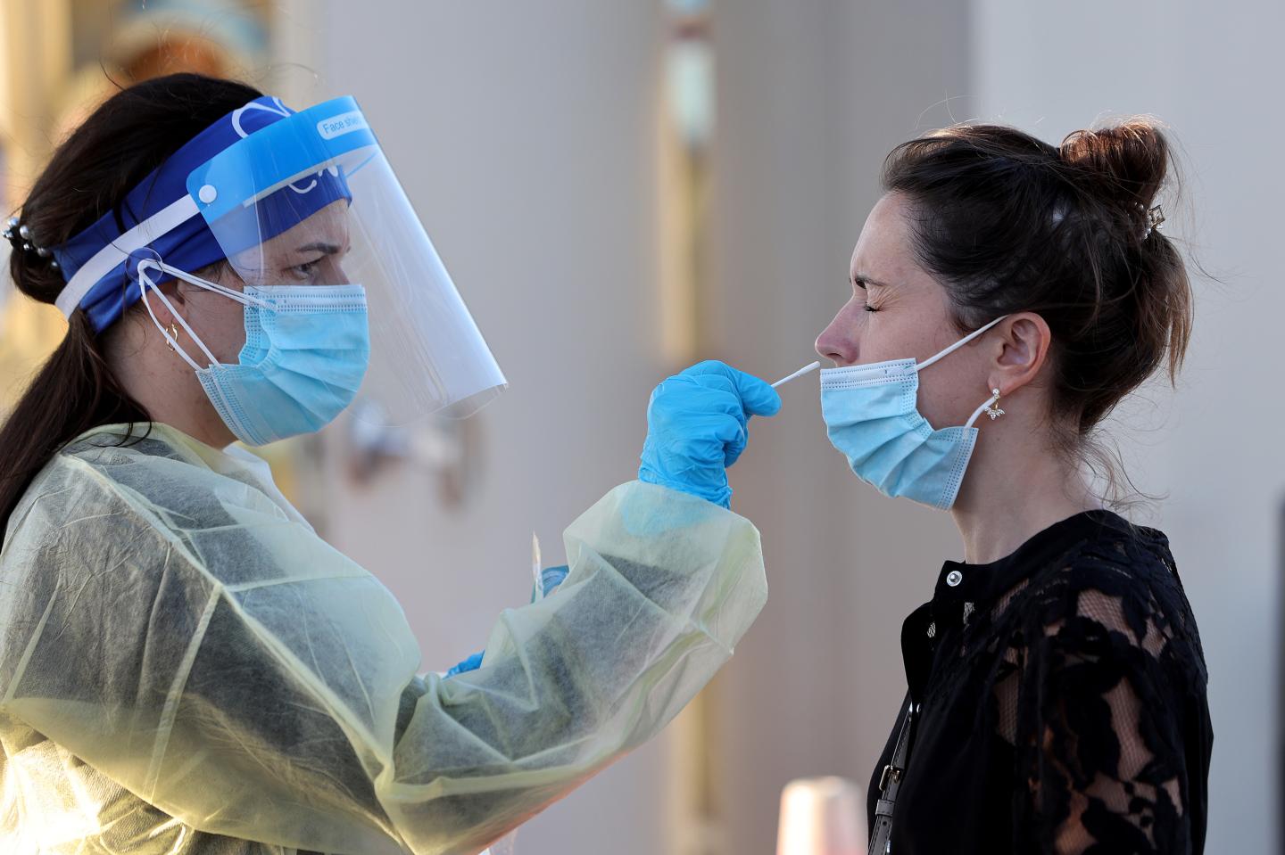 A woman gets a COVID test in North Miami