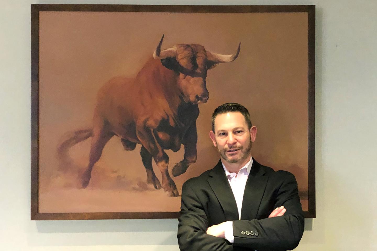 David Lowe poses for a portrait in his office.