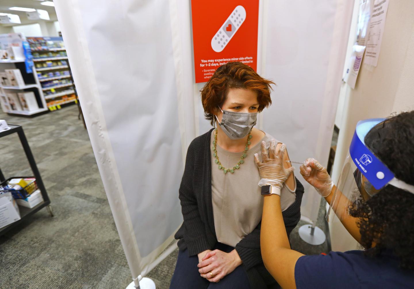 Woman gets COVID vaccine at CVS