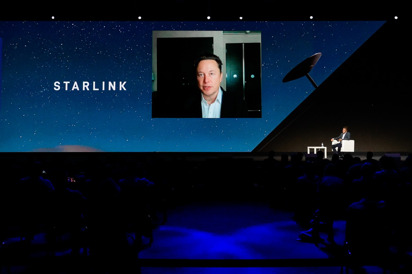 Elon Musk speaking at an industry trade show