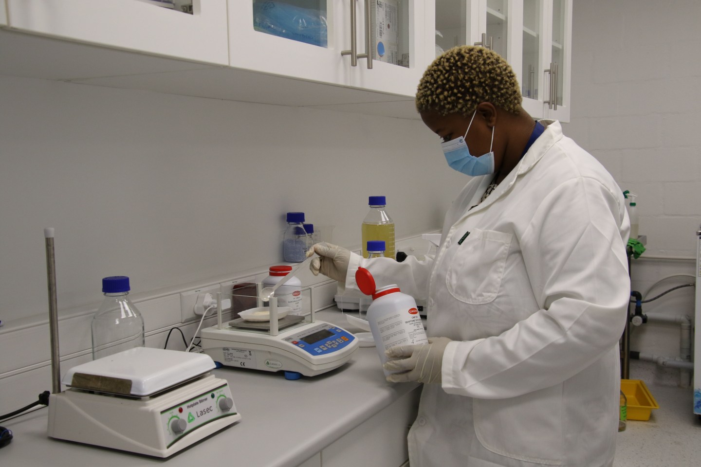 A research trainee works in Afrigen’s biotechnology lab in Cape Town, South Africa
