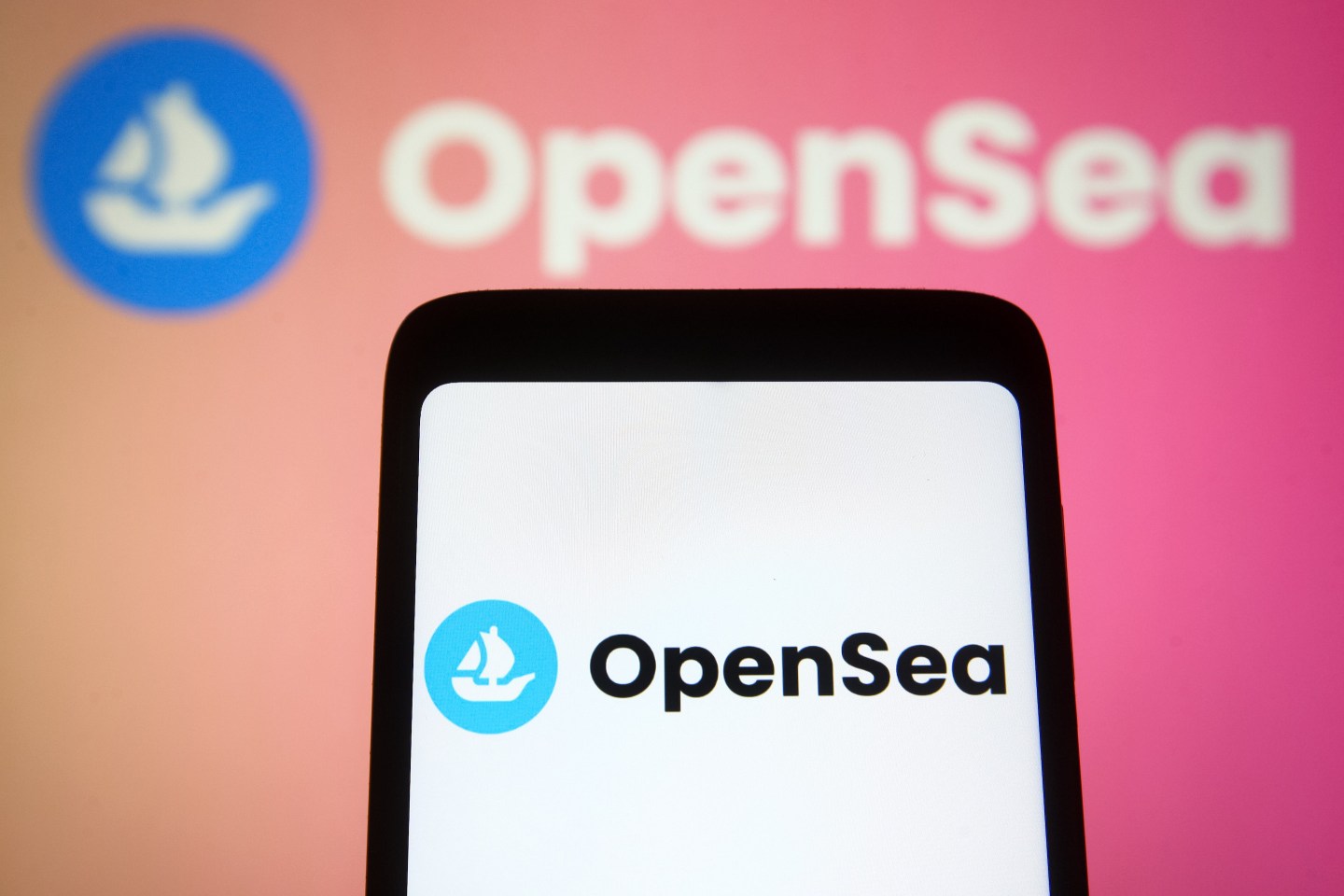 OpenSea logo on a smartphone