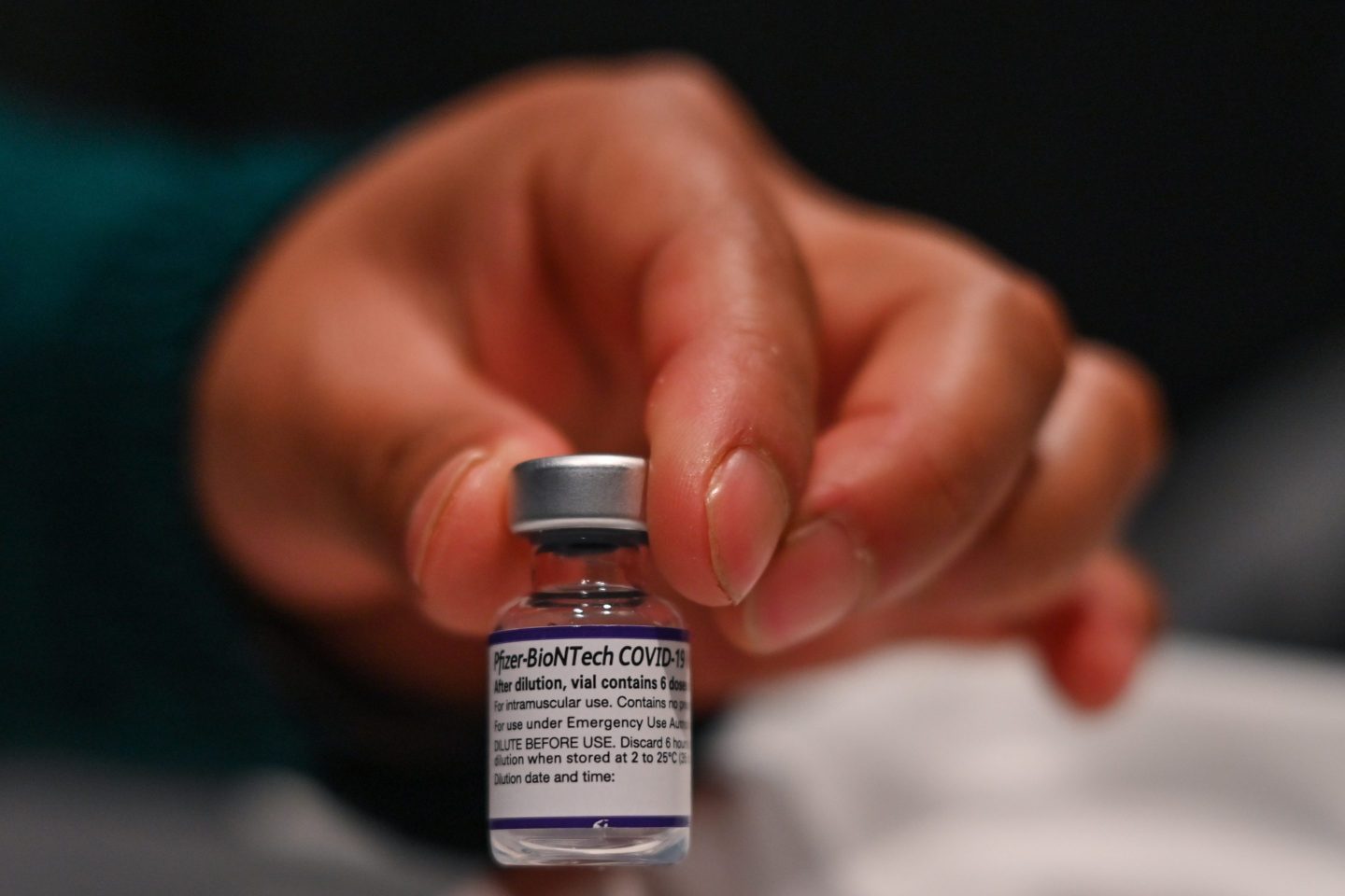 Nurse holding Pfizer COVID-19 vaccine