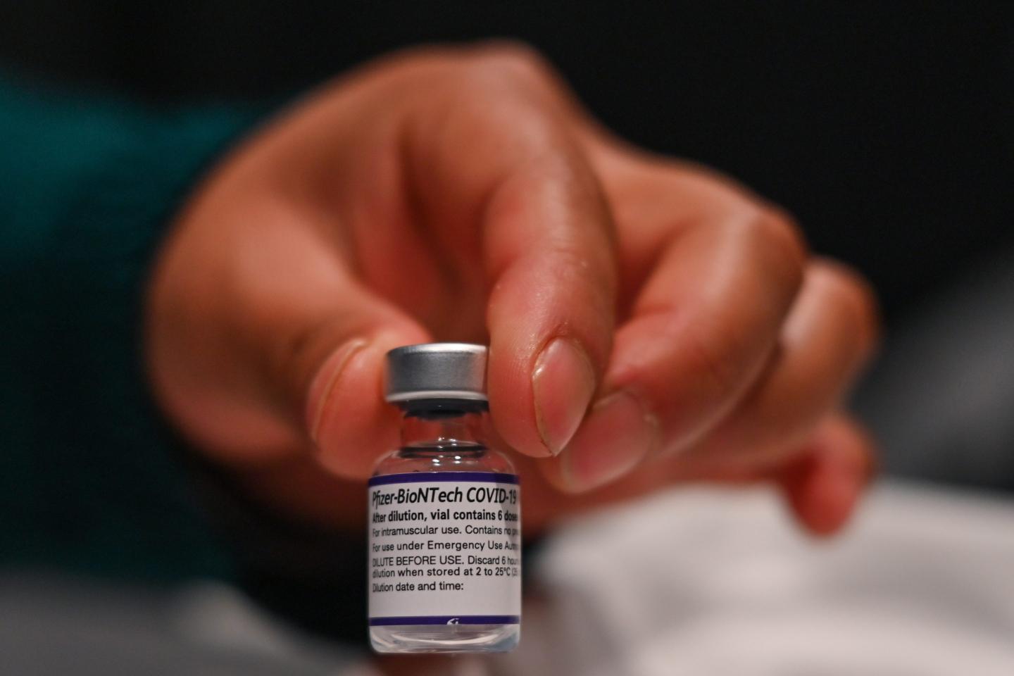 Nurse holding Pfizer COVID-19 vaccine