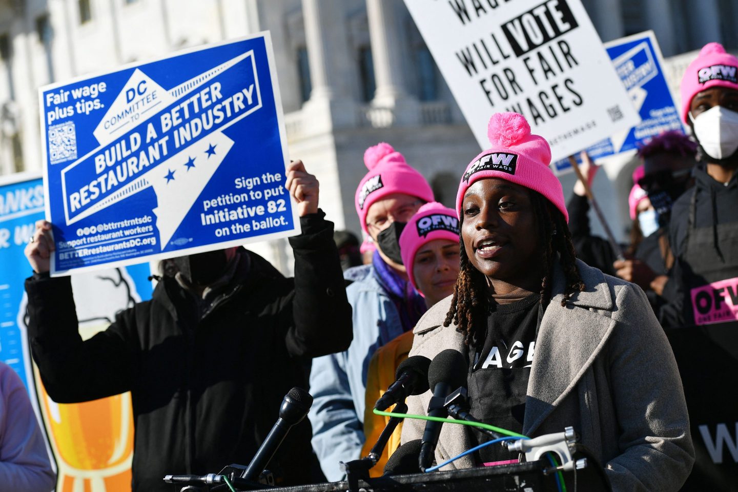 A restaurant worker at a rally for a higher minimum wage.