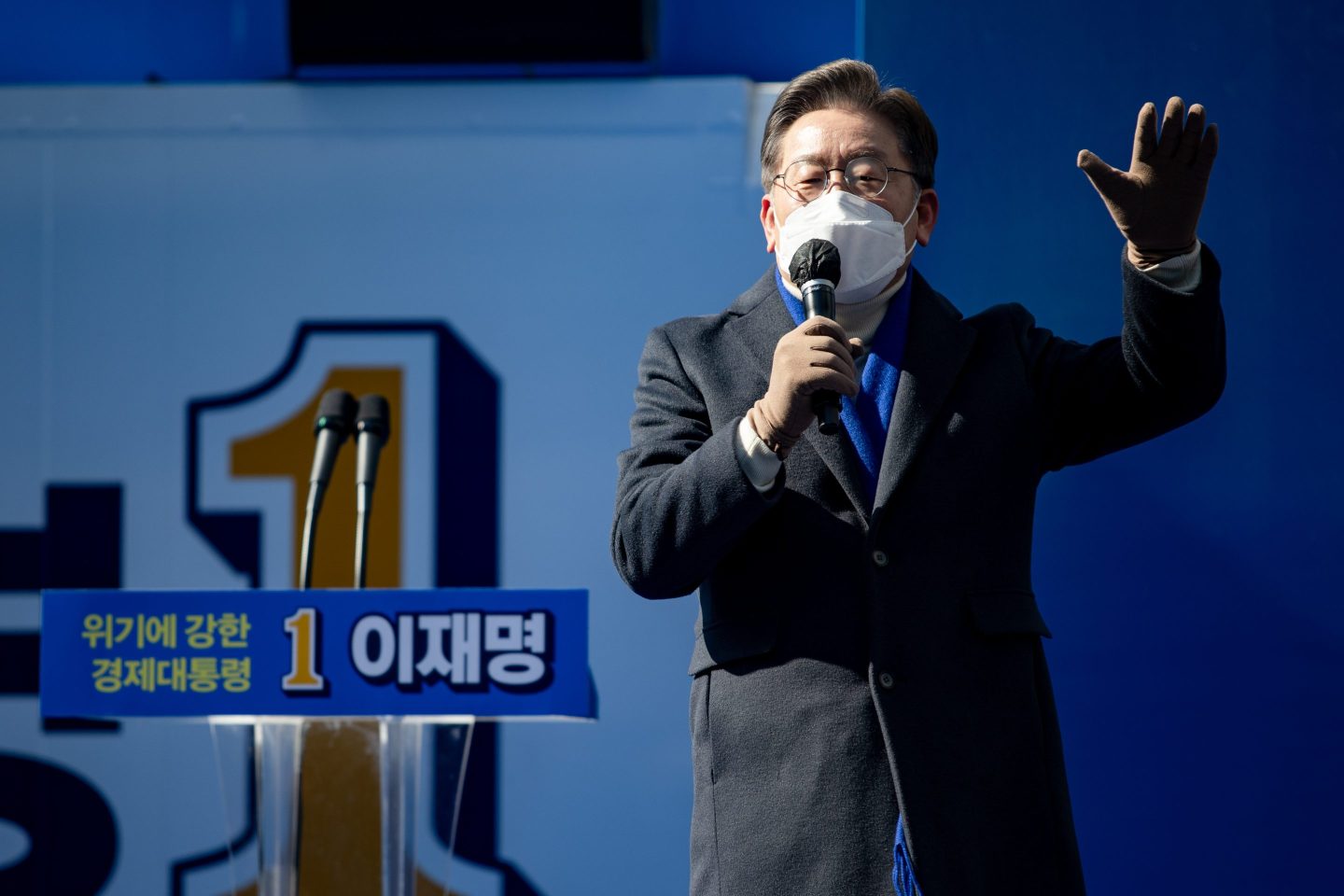 Korean presidential candidate Lee Jae-myung gives a speech while wearing a face mask
