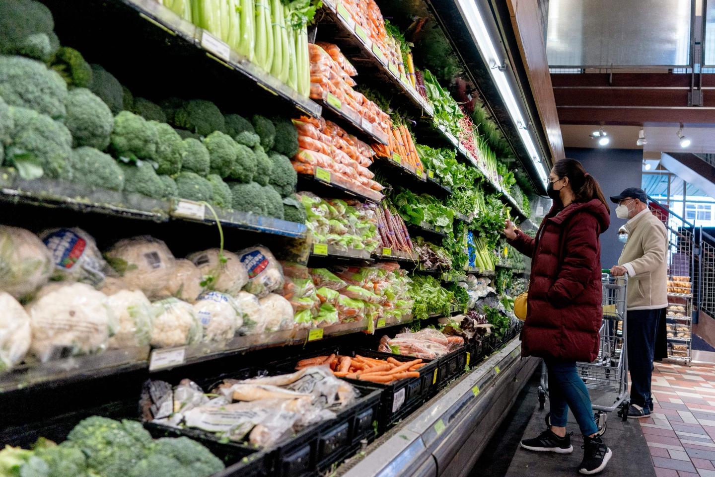 People shopping at grocery store