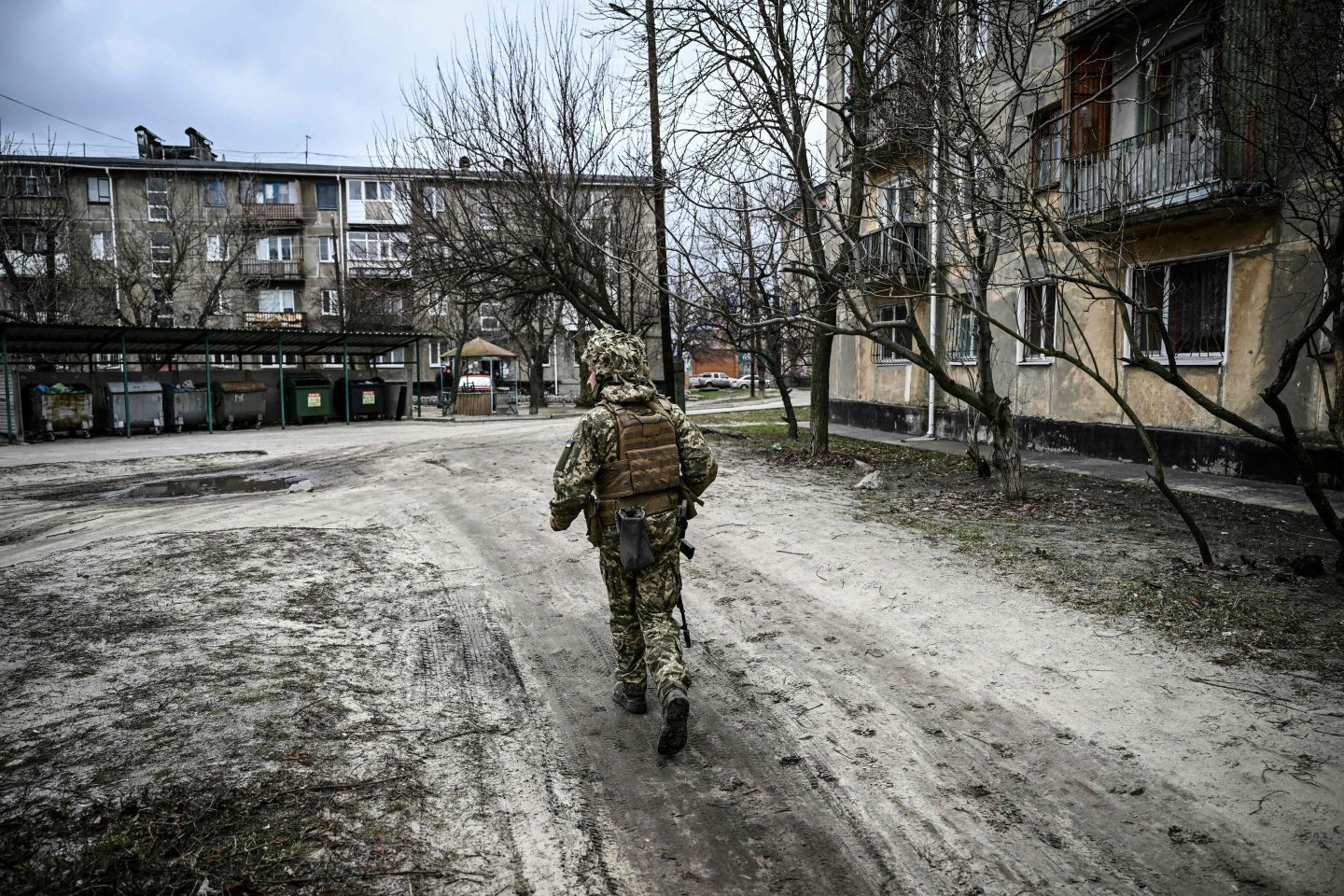 A Ukraine army soldier walks in the town of Schastia