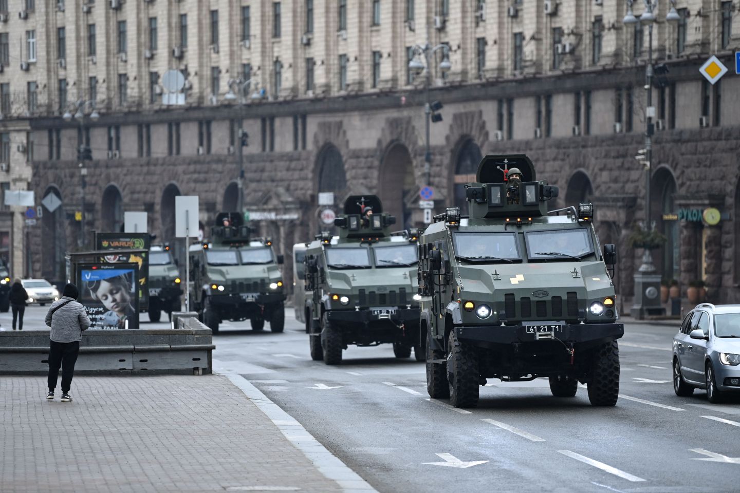 Ukrainian military vehicles move past Independence Square in central Kyiv.