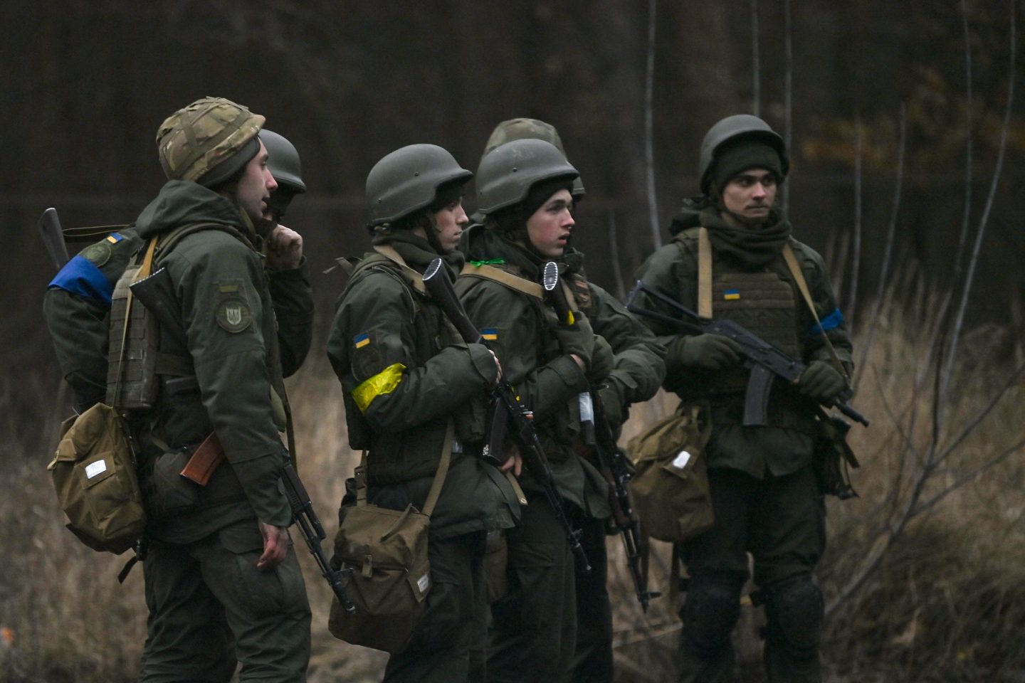 A photo of Ukrainian servicemen standing at a location north of Kyiv, on February 24, 2022.
