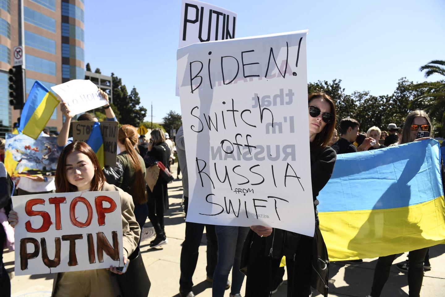 Protestors holding signs