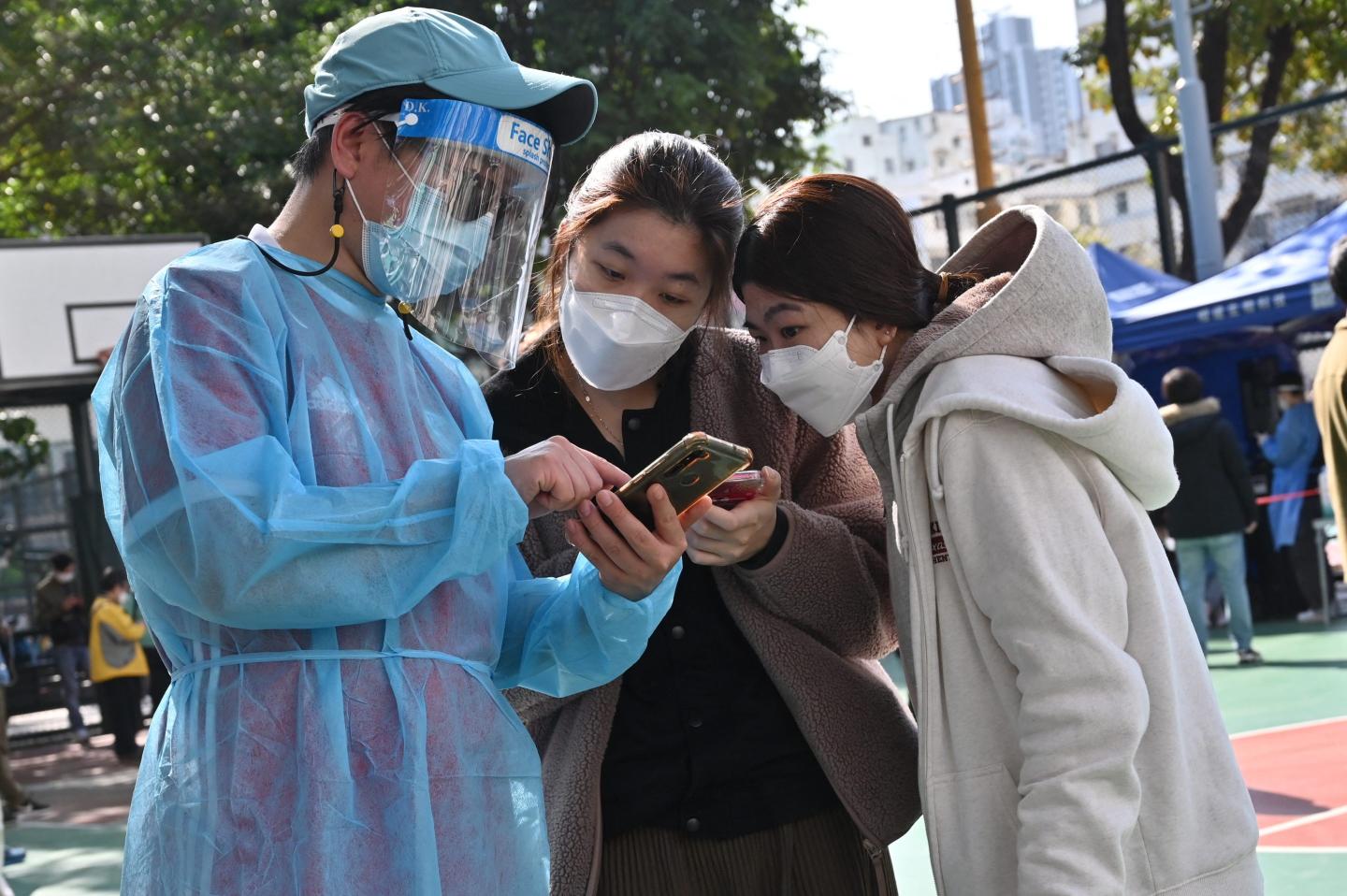 Record Omicron outbreak is forcing Hong Kong to abandon some pillars of Beijing’s COVID-zero strategy