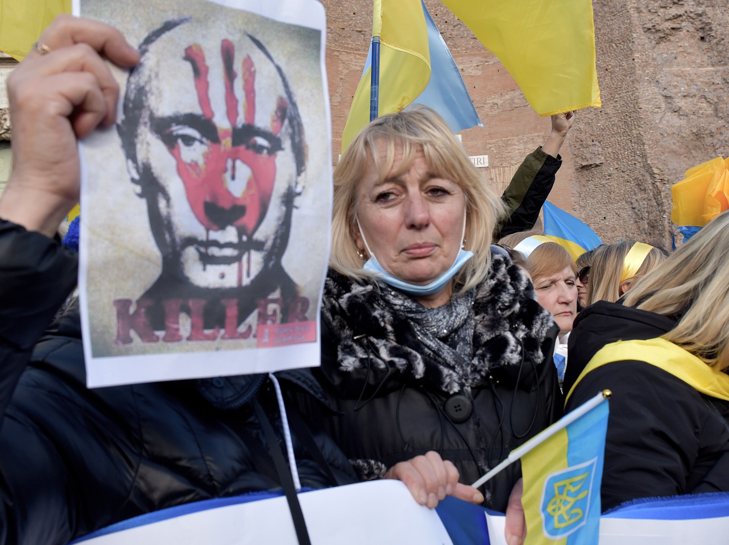 Women with posters depicting Putin as a murderer participate in the demonstration in Piazza della Repubblica against the war in Ukraine organised by the Ukrainian community in Rome,on February 27, 2022 in Rome, Italy.