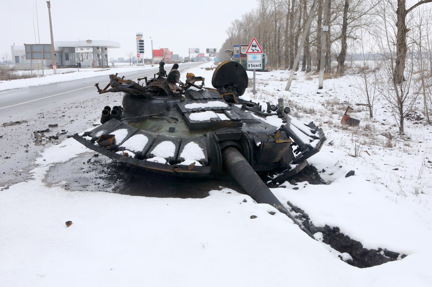 A blown-off tank turret lies on the ground on the outskirts of Kharkiv, northeastern Ukraine.