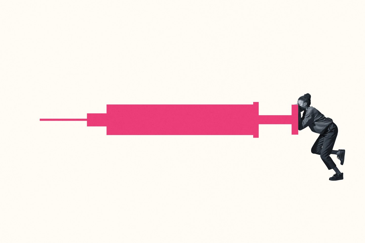 Young woman pushing a large syringe