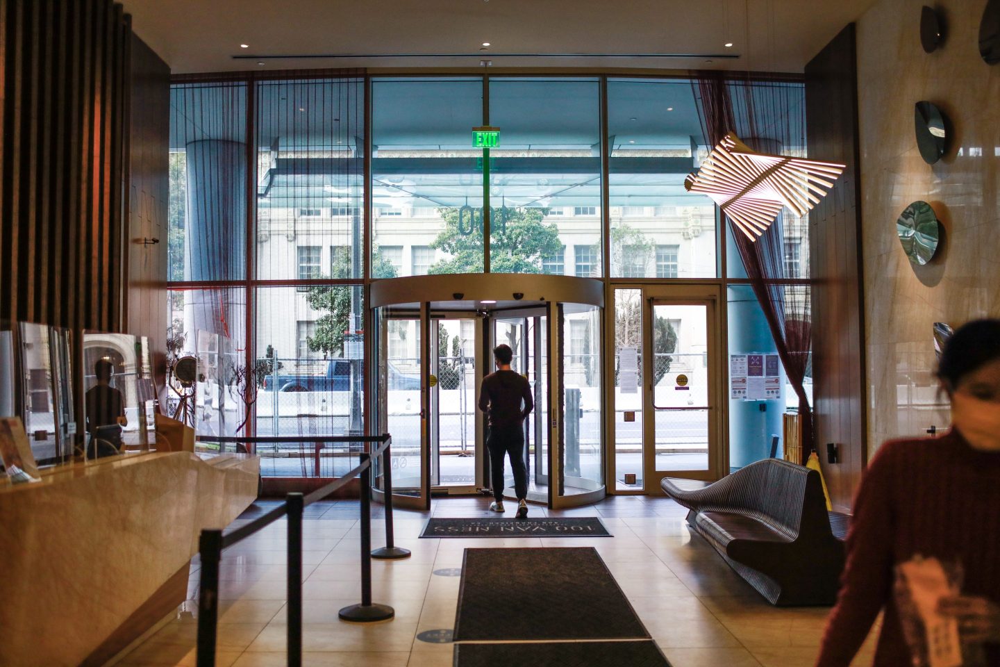 A man walks out a door