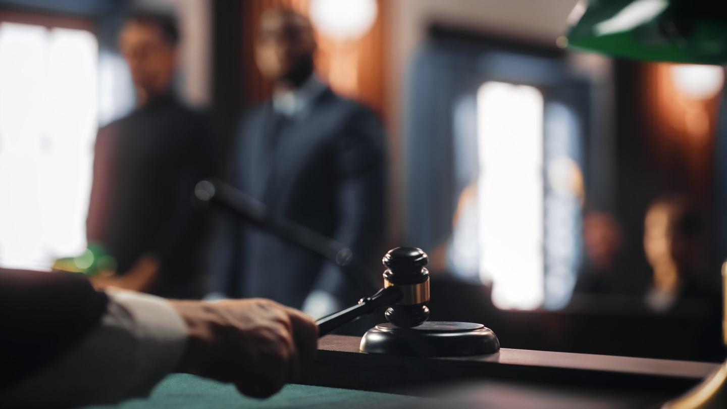 Close Up of a striking gavel in a court of law.