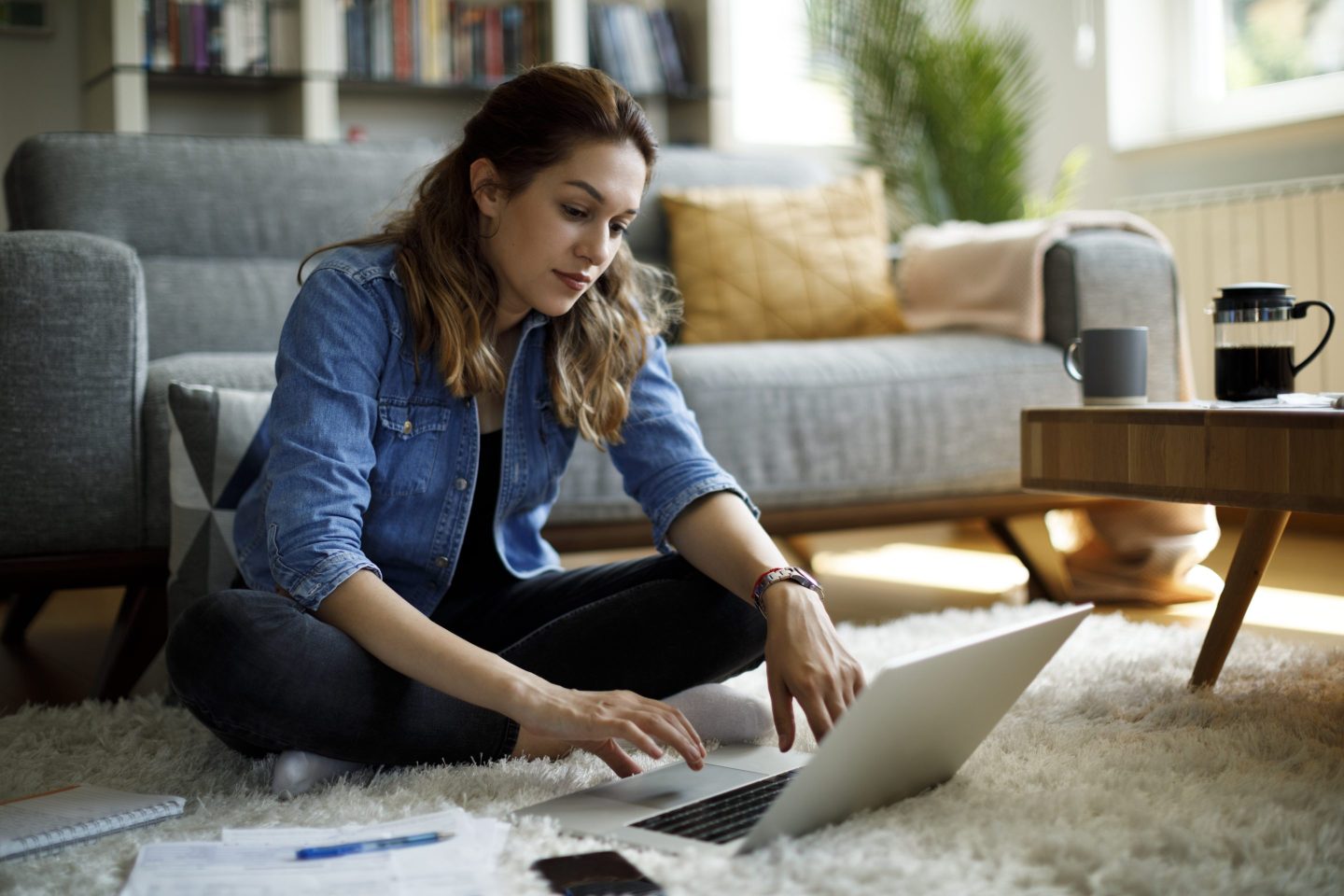 Young woman searching for a new job on laptop