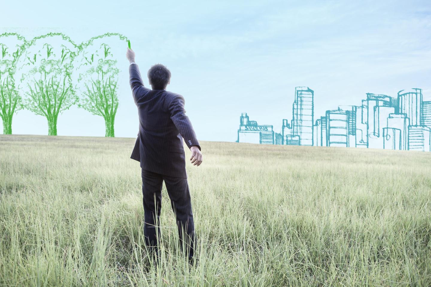 businessman drawing trees on the sky
