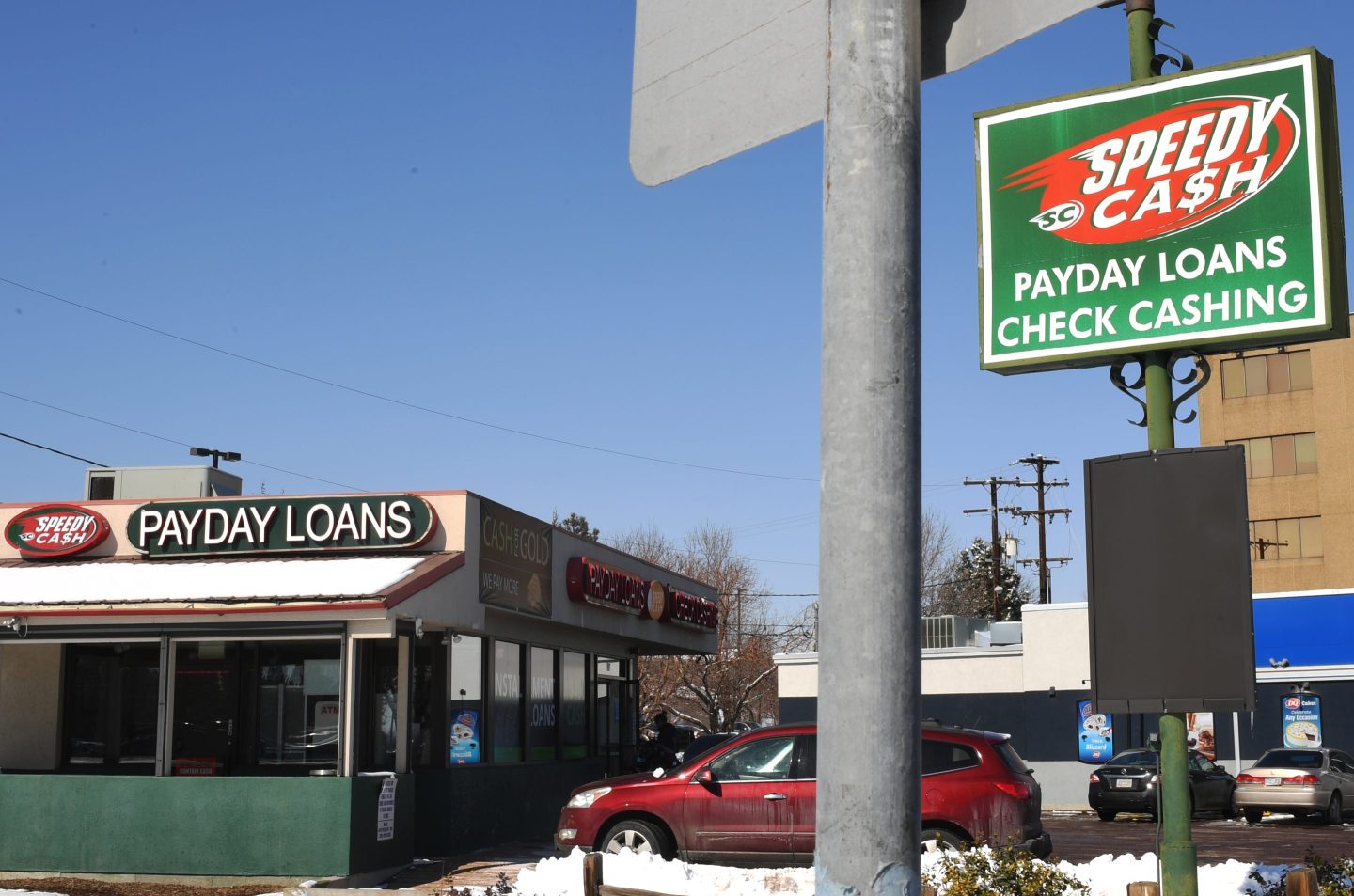 Payday loan store sign on a pole and storefront