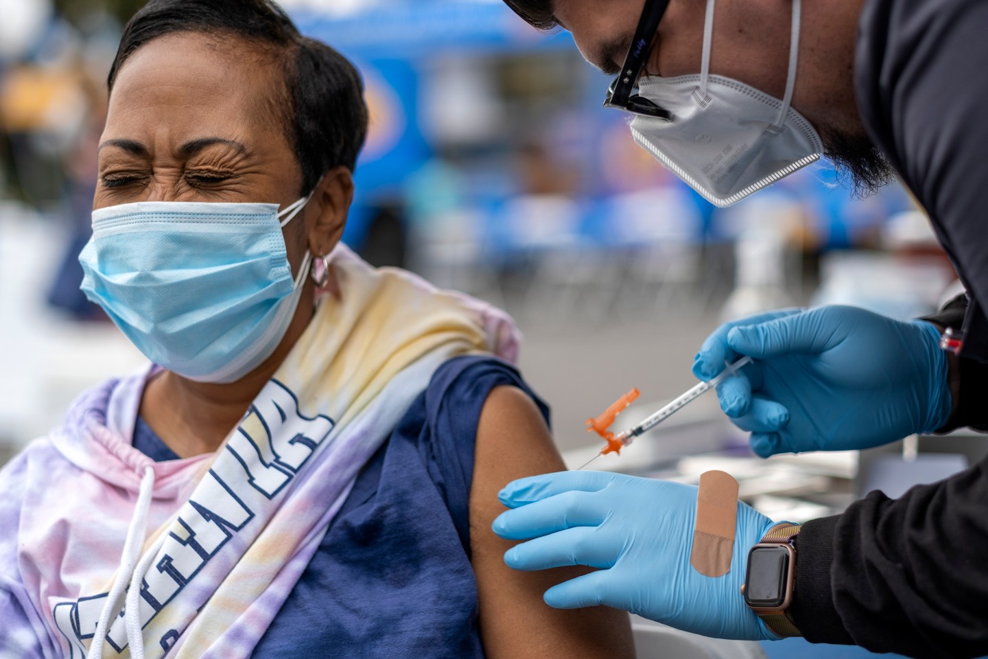 Micheal Federico, right, gives Rosie Robinson, left, a vaccinination at the historic First African Methodist Episcopal Church (FAME) on Saturday, Jan. 29, 2022 in Los Angeles, CA.