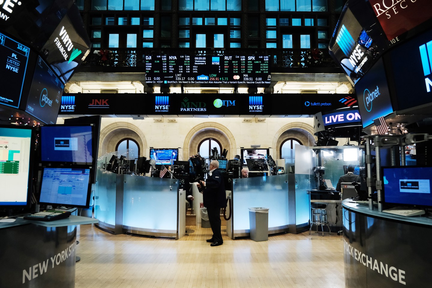 Two traders work on the floor of the New York Stock Exchange
