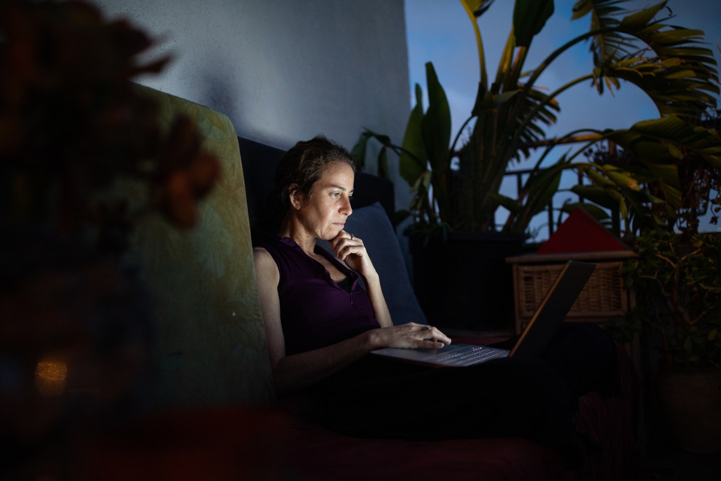 Woman working on laptop from home