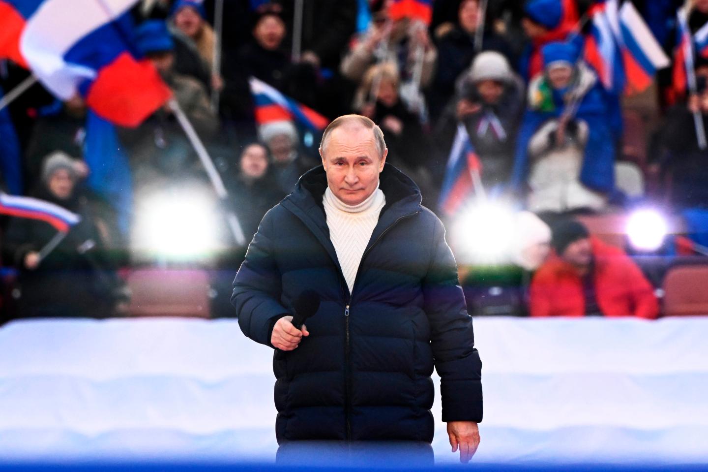 ‘For a world without Nazism’: Putin appears at packed patriotic rally as troops press attack in Ukraine