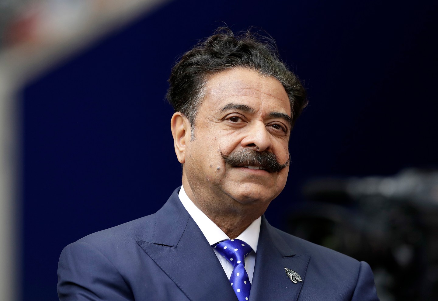 In this Sept. 24, 2017, photo, Jacksonville Jaguars owner Shahid Khan stands before an NFL football game against between the Jaguars and the Baltimore Ravens at Wembley Stadium in London. The Black News Channel shut down on Friday, March 25, after failing to meet its payroll and losing the support of its chief investor, Kahn. The network, founded by former GOP congressman J.C. Watts, relaunched last year following an investment by Kahn, hiring 250 Black journalists and production personnel.