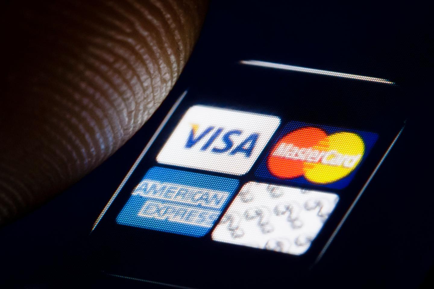 In this photo illustration the logos of credit cards Visa, Mastercard, and American Express are displayed on a smartphone on Jan. 2, 2019, in Berlin.