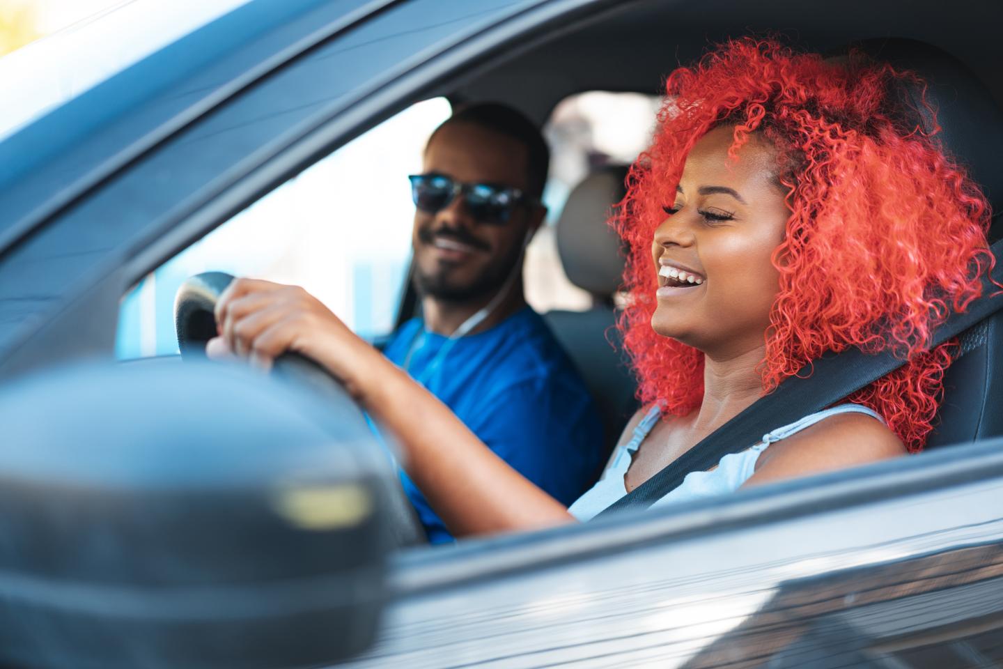A woman driving a car.