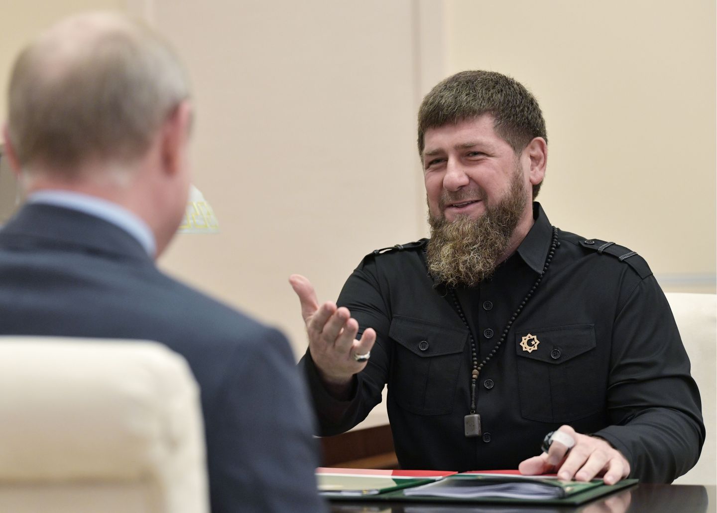 Head of the Chechen Republic Ramzan Kadyrov (R) speaks with Russian President Vladimir Putin