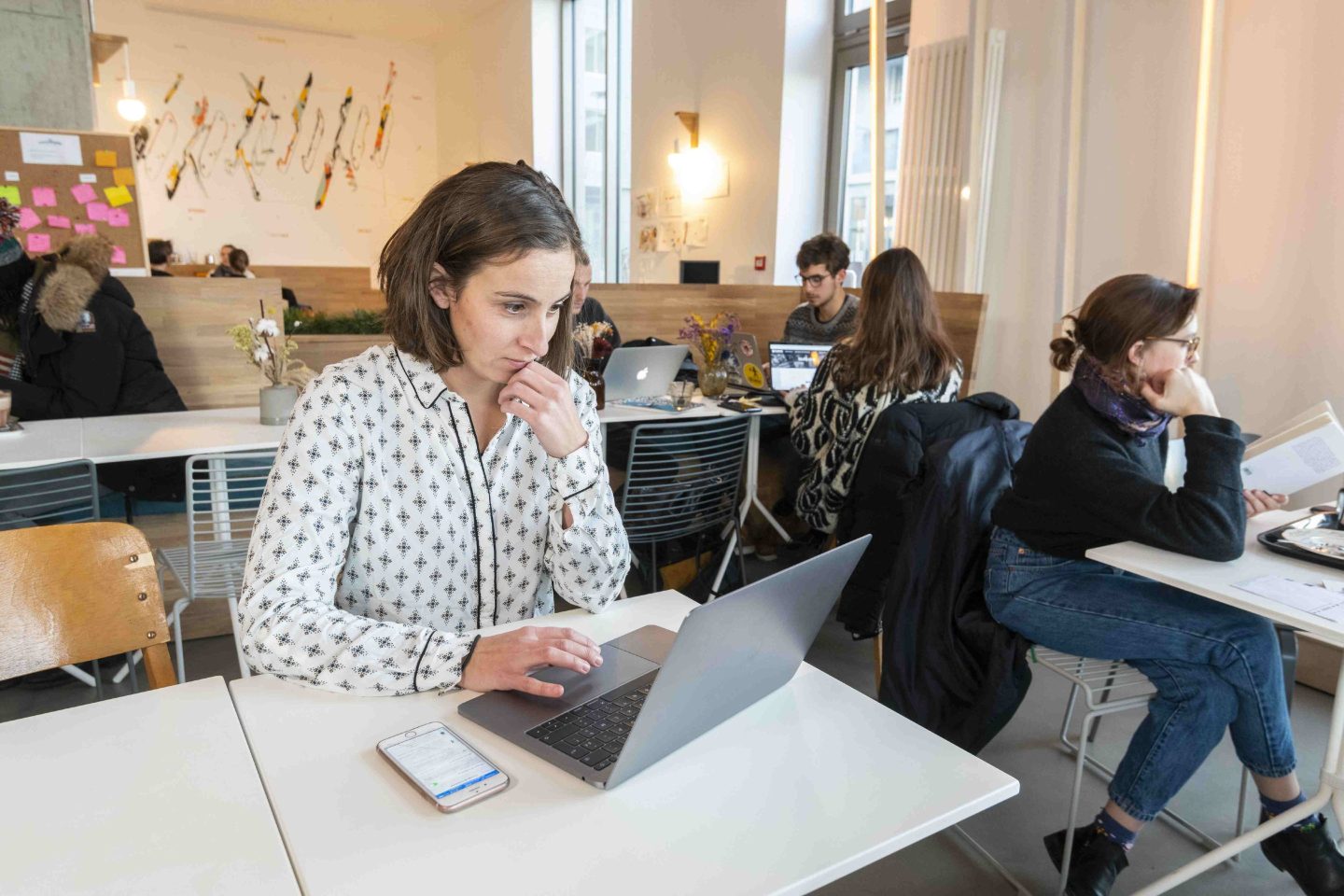 Woman does research on her laptop.